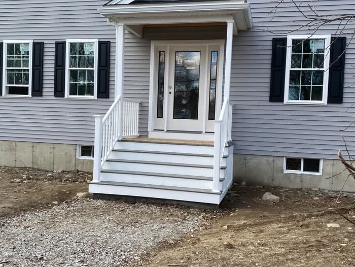 Front door with white steps